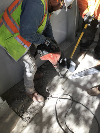 breaking concrete on site up close