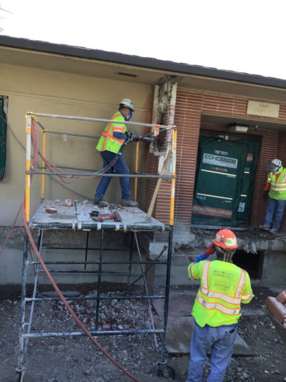 breaking brick wall on site