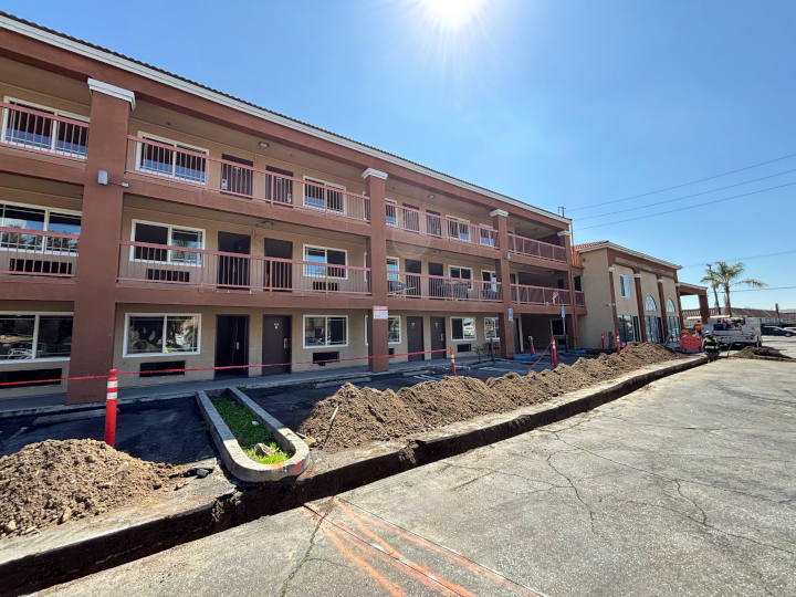 view of parking stalls and driveways repurposed